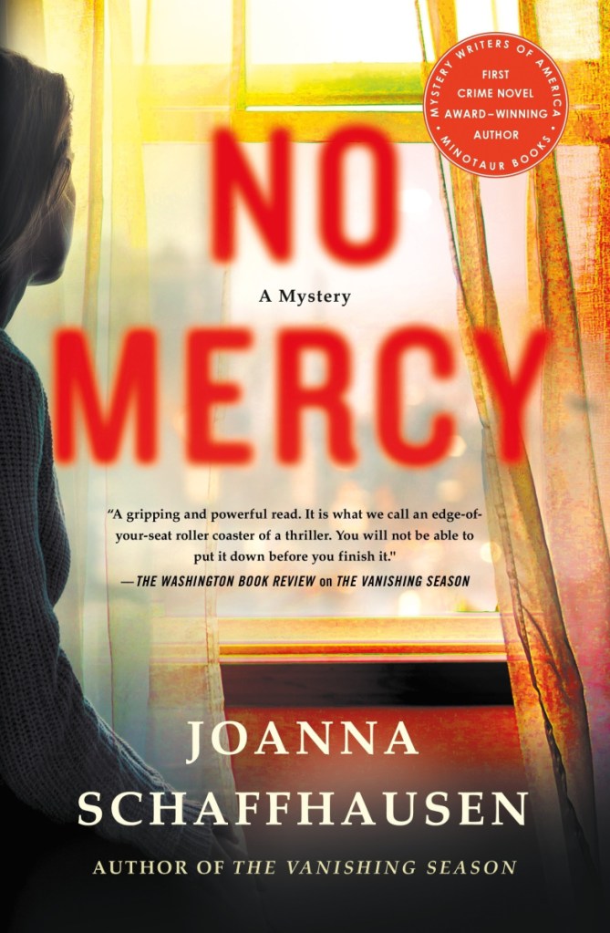 This cover image released by Minotaur shows "No Mercy," a mystery by Joanna Schaffhausen. (Minotaur via AP)