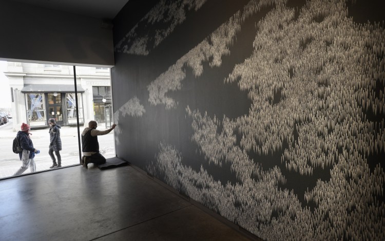No studio for Kevin Townsend, who prefers to create in full public view. As passersby wander down Congress Street in Portland, Townsend works on a wall piece that will anchor "Drawing Now" at the Institute of Contemporary Art at Maine College of Art.