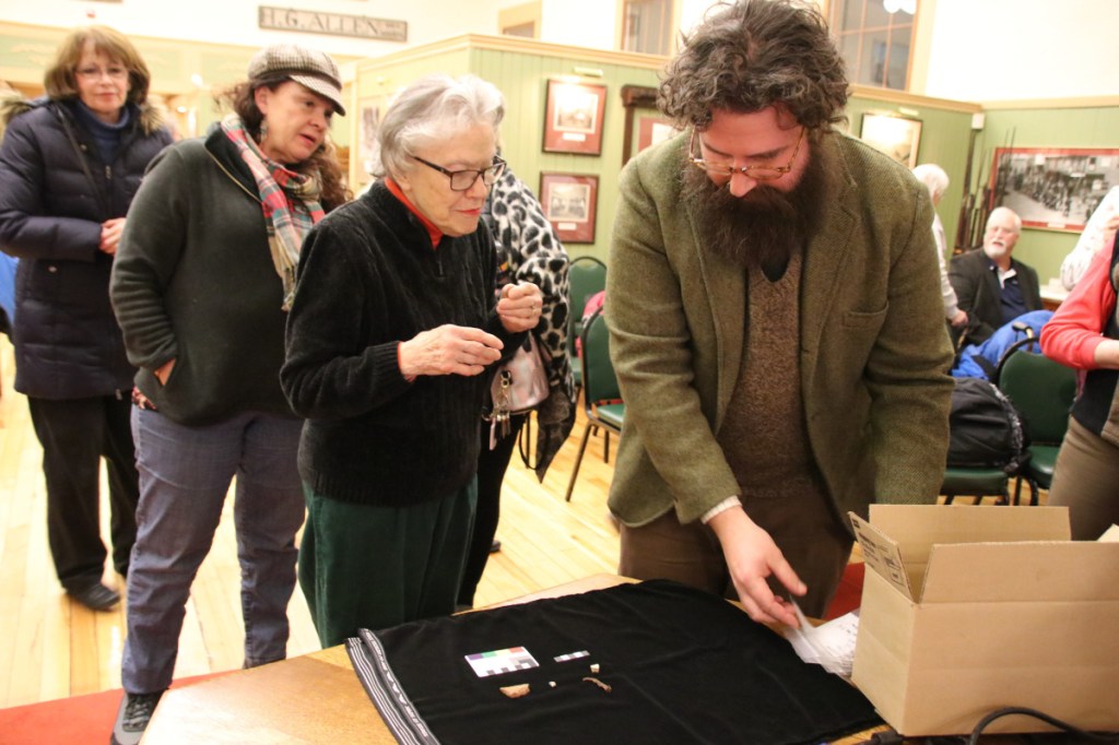 Terry Parsons chats with University of New England professor Arthur Anderson about artifacts found at an August archaeological dig in south Sanford during a presentation at the Sanford Springvale Historical Museum on Thursday. Those conducting the dig had hoped to find evidence of the 1740s Phillipstown garrison.
