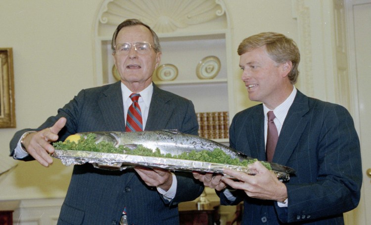 President George H.W. Bush, left, and Vice President Dan Quayle display the first salmon caught in Maine in 1990. Fish farms could help renew what was a long-standing White House tradition, a reader says.