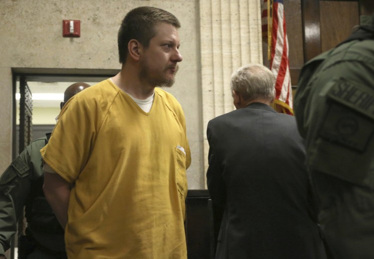 Former Chicago police Officer Jason Van Dyke is escorted into the courtroom for his sentencing hearing at the Leighton Criminal Court Building in Chicago on Friday, for the 2014 shooting of Laquan McDonald.