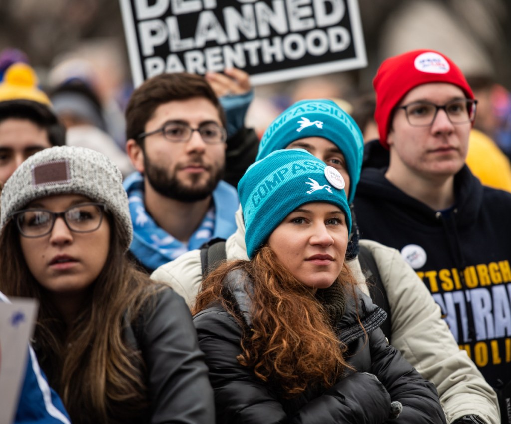 Crowds listen intently at the March for Life rally Friday on the National Mall. President Trump spoke to the participants via video.