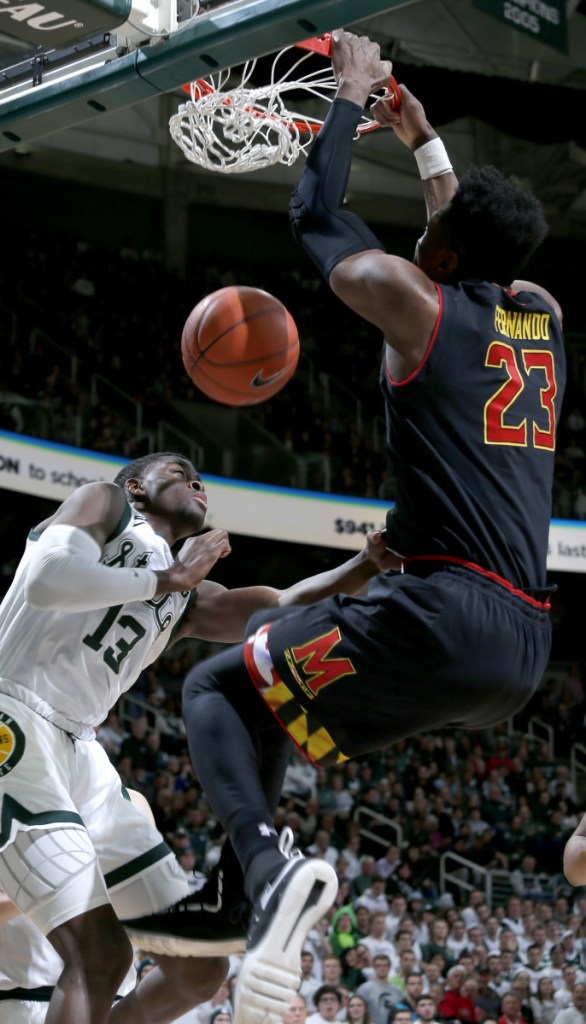 Bruno Fernando of Maryland dunks on Gabe Brown of Michigan State during Michigan State's 69-55 victory Monday.