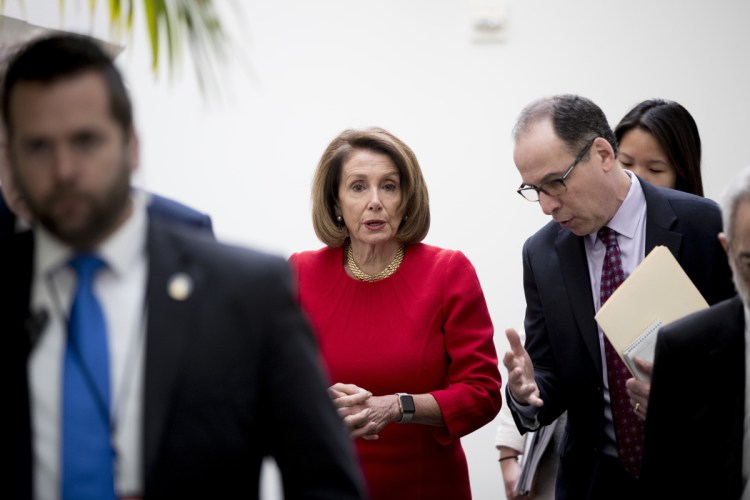 House Speaker Nancy Pelosi of California leaves a House Democratic Caucus meeting on Capitol Hill in Washington on Wednesday. She officially informed President Trump that the House would not authorize his appearance to deliver his State of the Union until the partial government shutdown ends.
