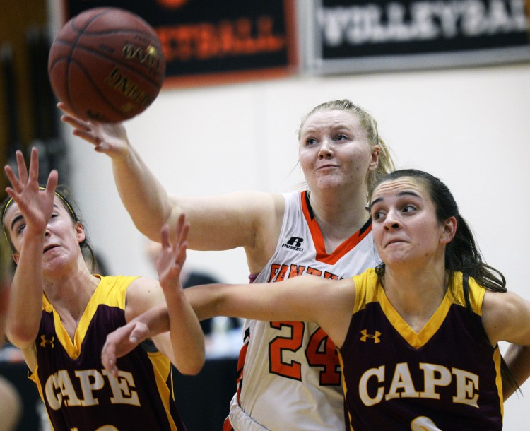 Sydney Plummer, center, of North Yarmouth Academy battles for a rebound with Cape Elizabeth's Brooke Harvey, left, and Alison Ingalls during NYA's 50-45 girls' basketball win Wednesday.
