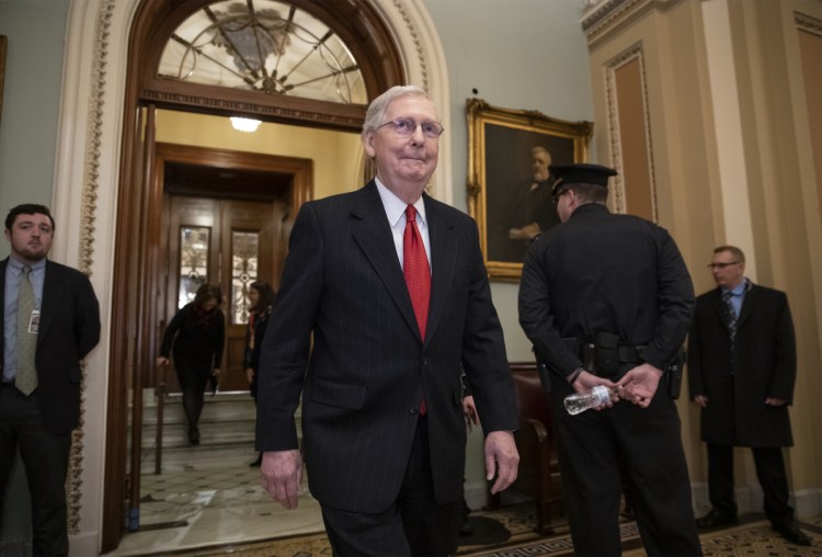 Senate Majority Leader Mitch McConnell, R-Ky., steps out of the chamber prior to a vote on ending the partial government shutdown, at the Capitol in Washington on Thursday.