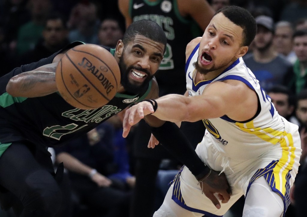 Warriors guard Stephen Curry, right, attempts to steal the ball from Kyrie Irving of the Celtics during Golden State's 115-111 win Saturday night at TD Garden.