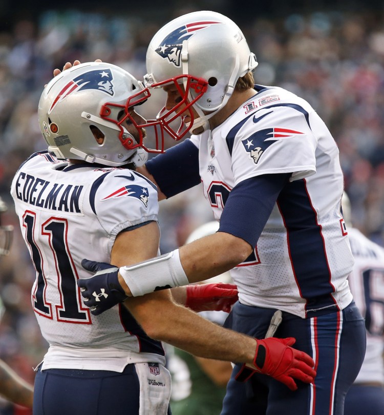 Tom Brady and Julian Edelman celebrating a playoff TD. Yup, it's happened a lot as they share a tight connection that has produced many memorable times for the Patriots.