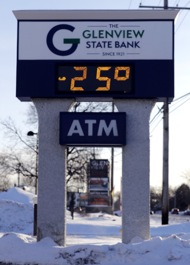 A sign shows the outdoor temperature in Glenview, Ill., Wednesday