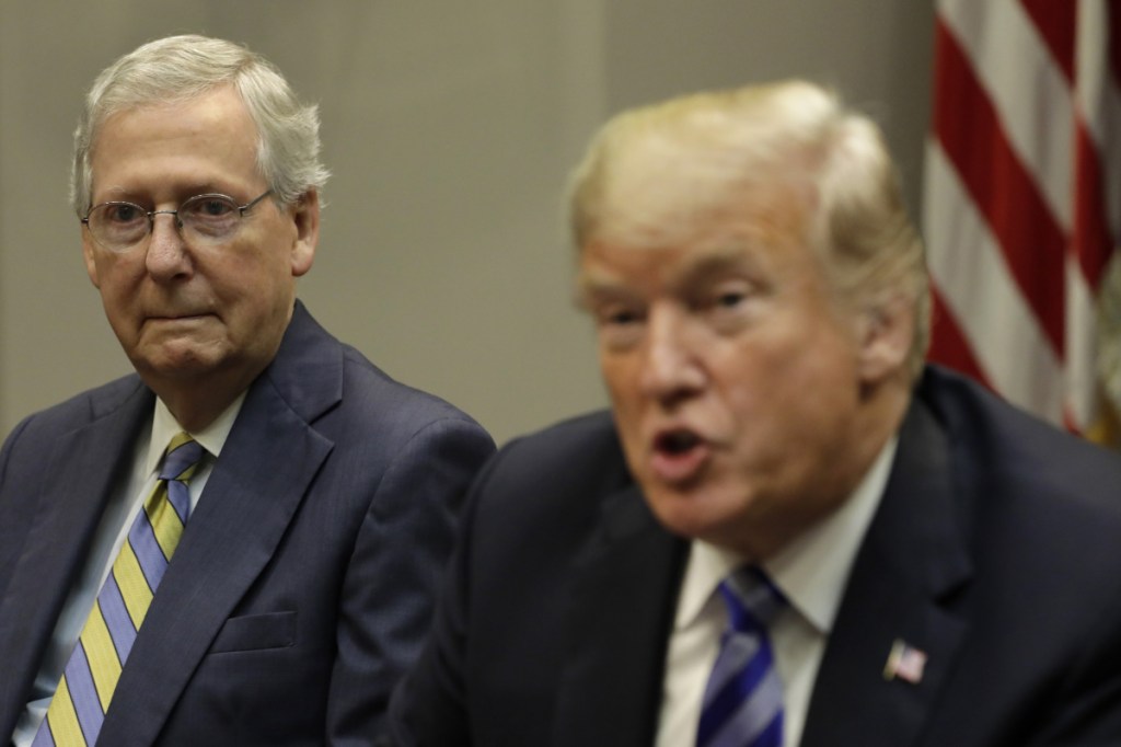 Senate Majority Leader Mitch McConnell listens to President Trump during a meeting with Republican congressional leadership in September.
Bloomberg /Yuri Gripas