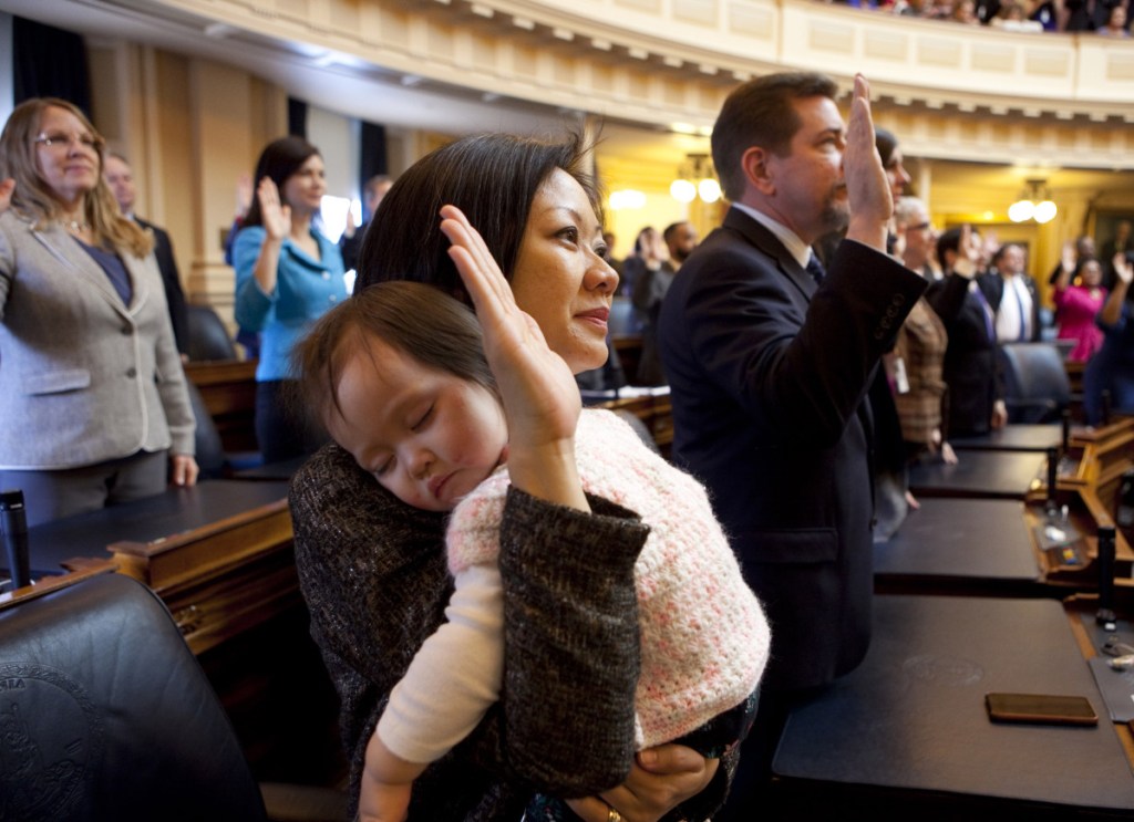 Virginia Del. Kathy Tran, with her daughter Elise at her swearing-in, says she misspoke about an abortion bill.