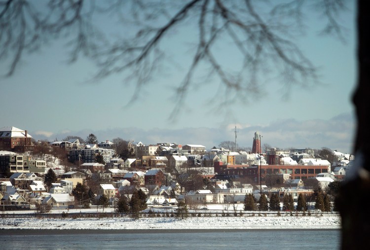 The snow-covered rooftops on the East End of Portland as seen from Back Cove after the overnight snowfall on Wednesday