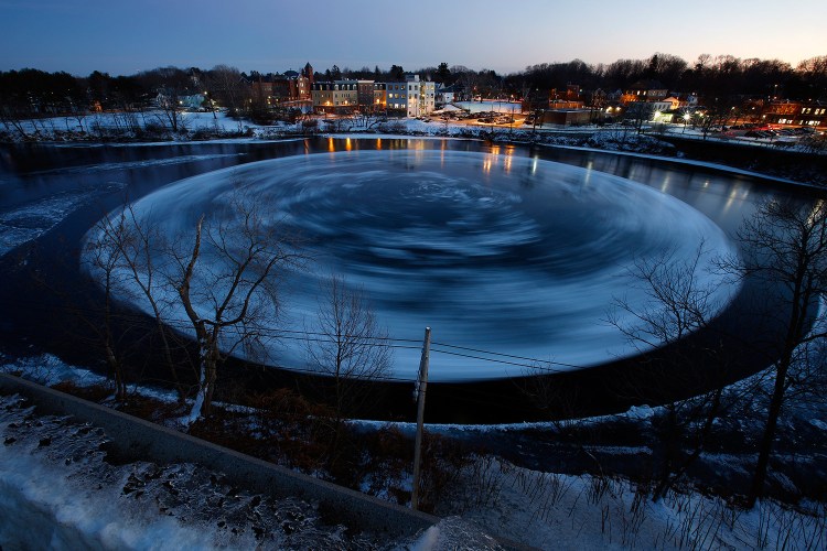 This 30-second exposure shows the circular ice floe spinning counter-clockwise Monday in the Presumpscot River below Bridge Street.