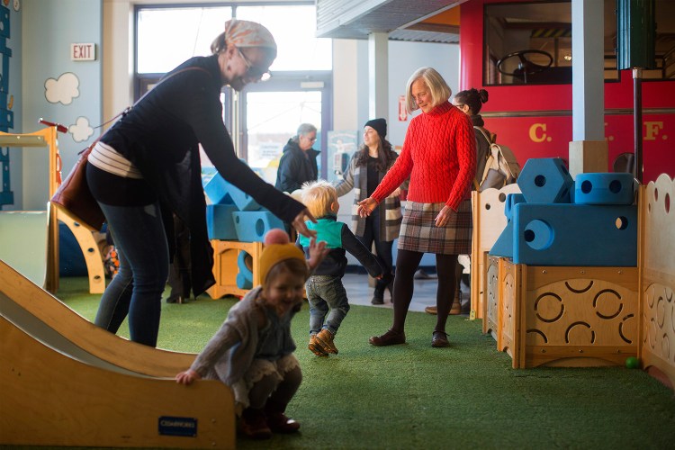 Suzanne Olson, right, works at the Children's Museum of Maine on Monday. Olson, the longtime director of the museum, will retire at the end of June.