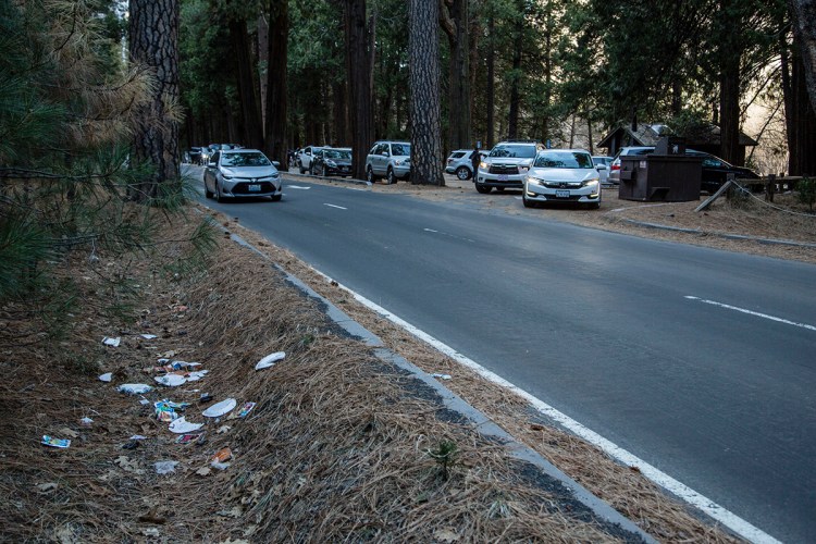 A road is lined with trash in Yosemite National Park, Calif. 
