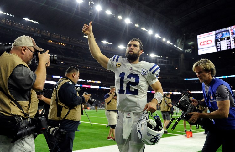 Indianapolis Colts quarterback Andrew Luck runs off of the field after leading the Colts to a 21-7 win over the Houston Texans in an AFC wild-card game on Saturday.