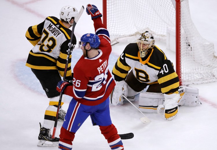 Montreal Canadiens defenseman Jeff Petry (26) raises his fist after beating Boston Bruins goaltender Tuukka Rask (40) on the game-winning goal during the Canadiens' 3-2 win Monday in Boston.