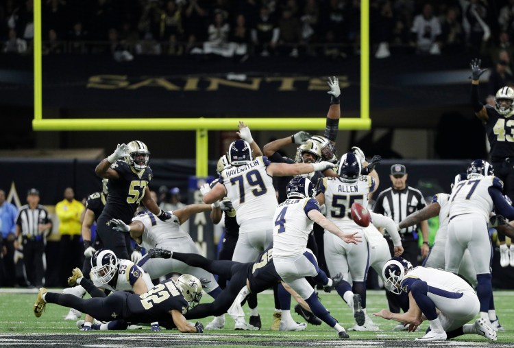 Los Angeles Rams kicker Greg Zuerlein kicks the game-winning field goal in overtime in the NFC championship game against the New Orleans Saints on Sunday in New Orleans. The Rams won 26-23.