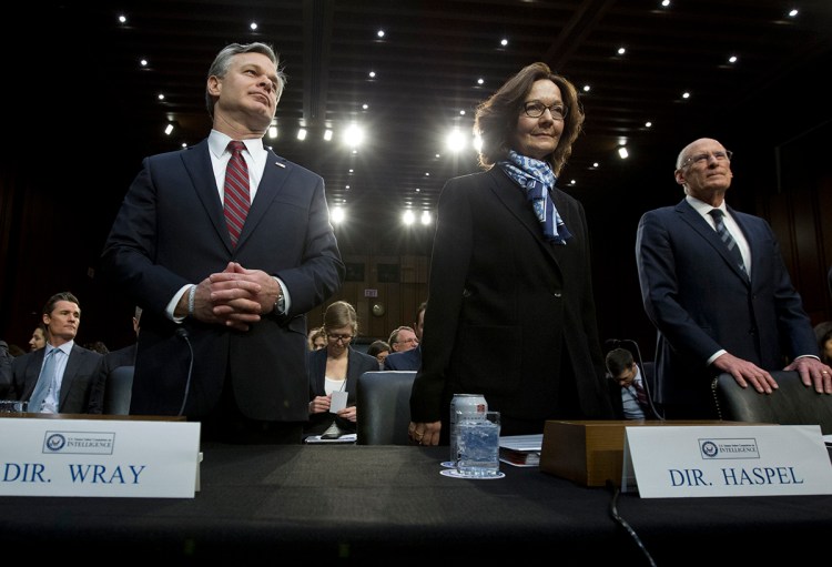 From left, FBI Director Christopher Wray, CIA Director Gina Haspel and Director of National Intelligence Daniel Coats arrive to testify before the Senate Intelligence Committee on Capitol Hill in Washington Tuesday, Jan. 29, 2019. (AP Photo/Jose Luis Magana)