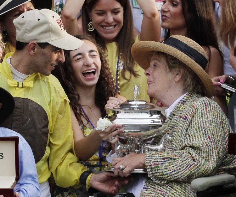 Phyllis Mills Wyeth, right, celebrates with jockey John Velasquez and supporters after her horse, Union Rags, won the Belmont Stakes on June 9, 2012, at Belmont Park in Elmont, N.Y.  Wyeth, who with her husband, Jamie, was a longtime Maine arts philanthropist, died Monday at age 78. 