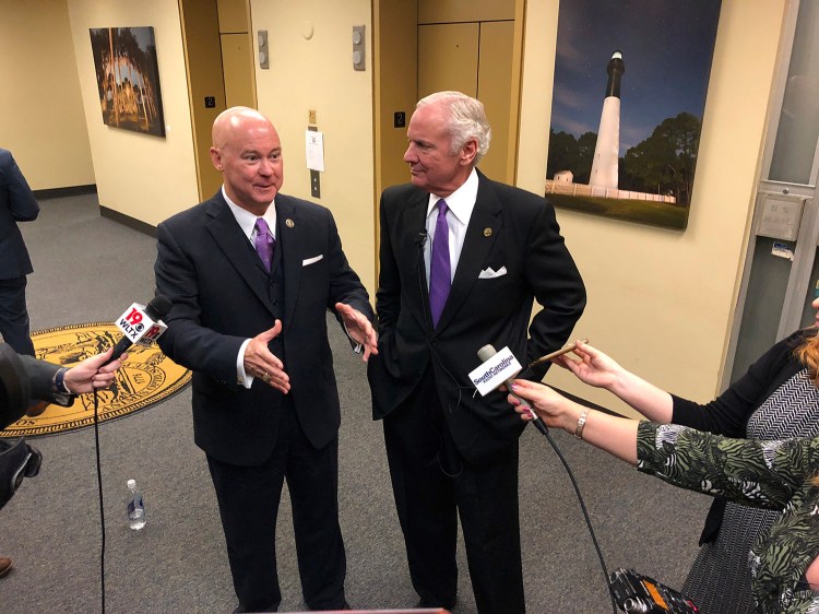 Chairman Tom Mullikin, left, of the South Carolina Floodwater Commission, speaks with South Carolina Gov. Henry McMaster about the goals of the new panel on Dec. 20, 2018, in Columbia, South Carolina. Mullikin is that rare conservative who knows that climate change is real and that human contribution is part of it, writes columnist Kathleen Parker.