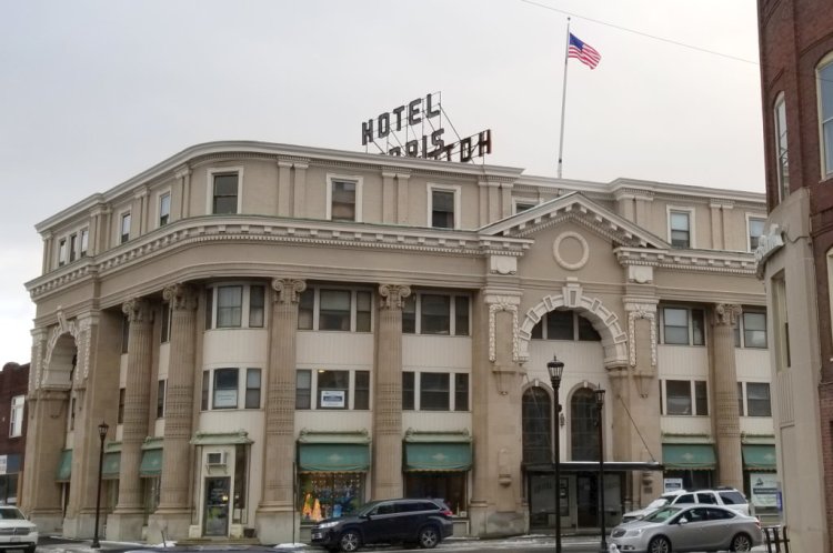 The Hotel Harris building, from Congress Street. The signs in the second-floor windows are in two of the three rooms offered to guests in the building, according to owner Jim Adinolfi. 