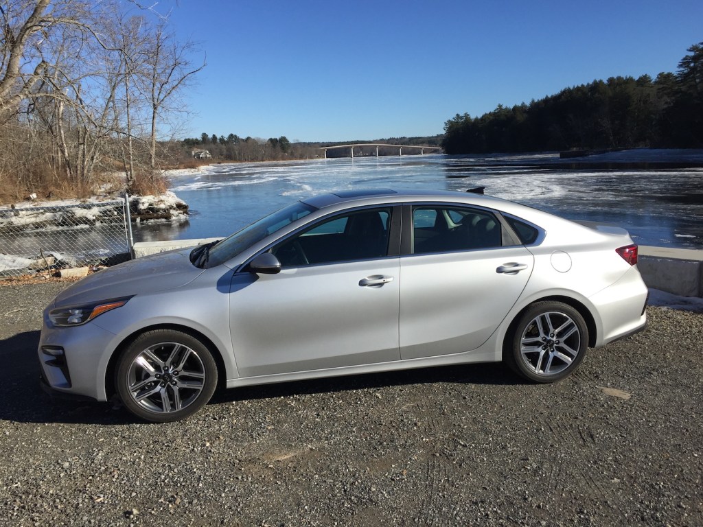 The latest Kia Forte, "a stylish, handsome four-door ... larger, more comfortable, and more capable than its predecessor." (Photo by Tim Plouff, by the Kennebec River in Richmond.)
