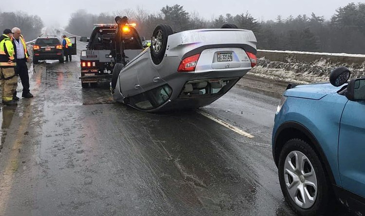 A driver headed north about 7:30 a.m. Thursday near mile marker 130 lost control on ice on bridge, hit both sides of concrete barriers lining a bridge and flipped over. 