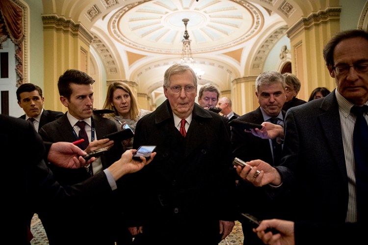Senate Majority Leader Mitch McConnell leaves for the day after two Senate bills to ending the partial government shutdown fail on Capitol Hill in Washington on Thursday.