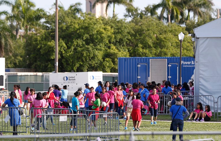 Migrant children play outside a former Job Corps site that now houses them in Homestead, Fla. in June.