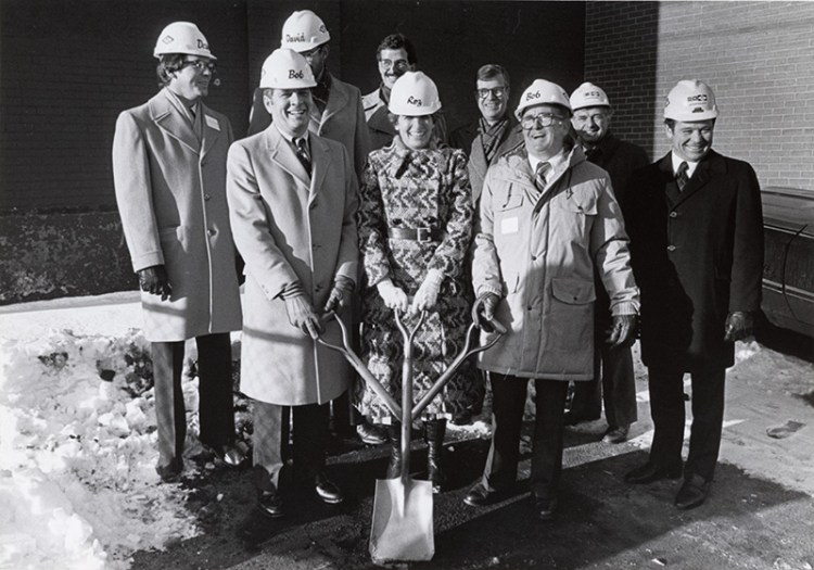 Rosalyne Bernstein stands in front holding a shovel at the groundbreaking for the Portland Museum of Art's Payson building, which opened in 1983. 