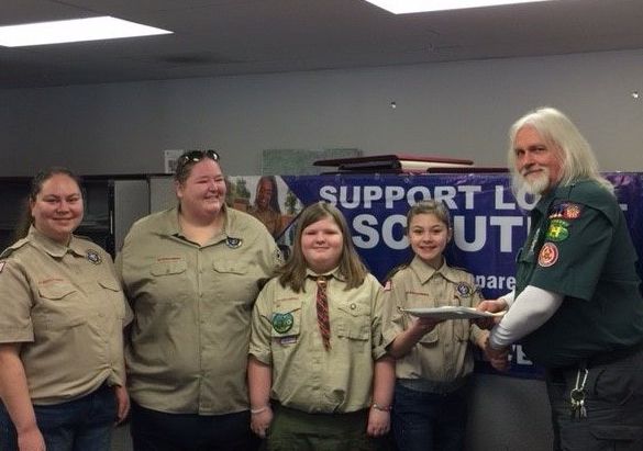 Six girls are joining the Pine Tree Council's First Scouts BSA troop from Lewiston, Troop 2019. Charters for new troops officially launch Friday. From left are Scoutmaster Casey Arsenault; Stephanie Gabriel, committee chairwoman; and Emillie Gabriel and Hannah Arsenault, presenting their troop charter to Abnaki District Executive Jack Waite.