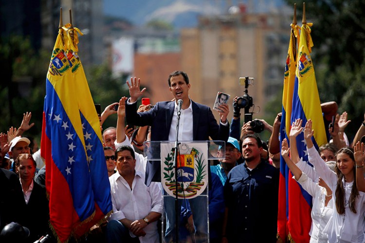 Juan Guaido, head of Venezuela's opposition-run congress, declares himself interim president of Venezuela, during a rally demanding President Nicolas Maduro's resignation in Caracas on Wednesday.