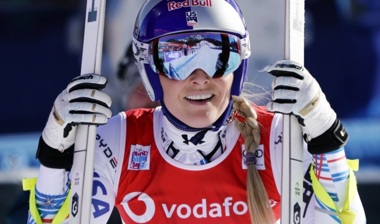 In this Friday, Jan. 18, 2019, file photo, United States' Lindsey Vonn smiles after completing the women's World Cup downhill ski race in Cortina D'Ampezzo, Italy. Vonn announced Friday, Feb. 1, 2019, that she will retire from ski racing after this month's world championships in Sweden (AP Photo/Giovanni Auletta, File)