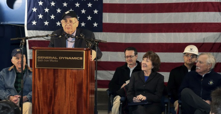 Retired U.S. Sen. Carl Levin of Michigan addresses a gathering Friday at Bath Iron Works in Bath. Seated in the front row are: Navy Secretary Richard Spencer, from left, and U.S. Sens. Susan Collins and Angus King, both of Maine.