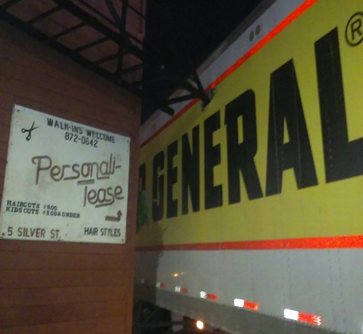 A fire escape punctured a tractor-trailer that was trying to make a delivery Saturday night to the Dollar General store in downtown Waterville.