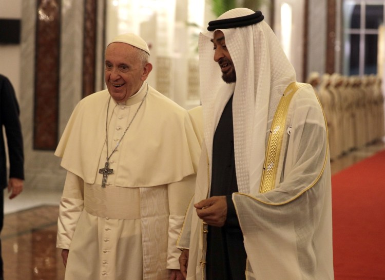 Pope Francis is welcomed by Abu Dhabi's Crown Prince Sheikh Mohammed bin Zayed Al Nahyan at the Abu Dhabi airport in United Arab Emirates on Sunday. 
