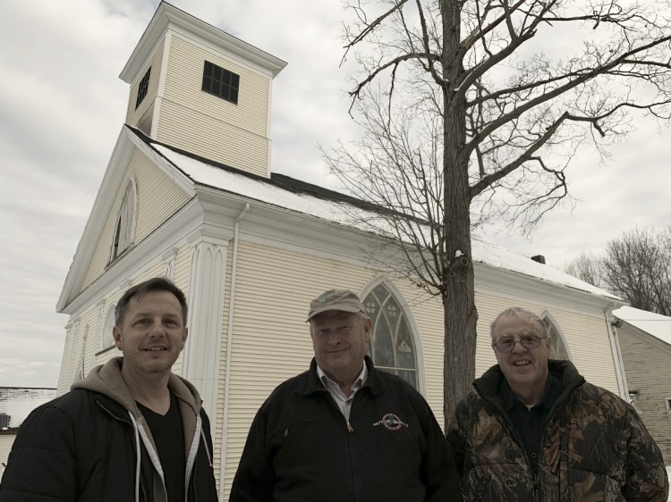 From left, pastor Ramsey Tripp, of Life Community Church, stands in front of the congregation's newly acquired church building in Gardiner with Dan Bailey and Dan McGrath, of the First Baptist Church of Gardiner, the seller. The churches plan to schedule services at different times to maximize shared use of their parking lots.