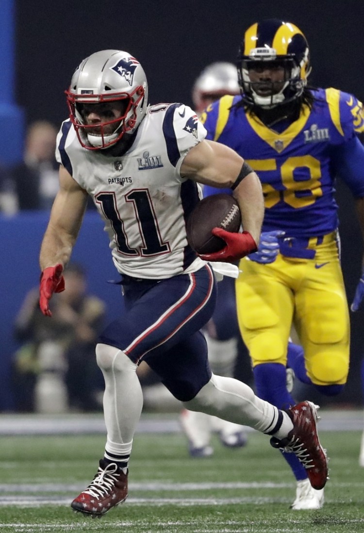 Julian Edelman finds room to run in the Rams' secondary, as he did often while making 10 catches for 141 yards.