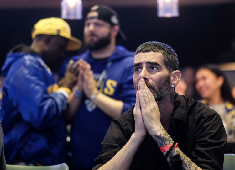 Rams fan Jason Skelton reacts during a viewing party near the end of Super Bowl 53.