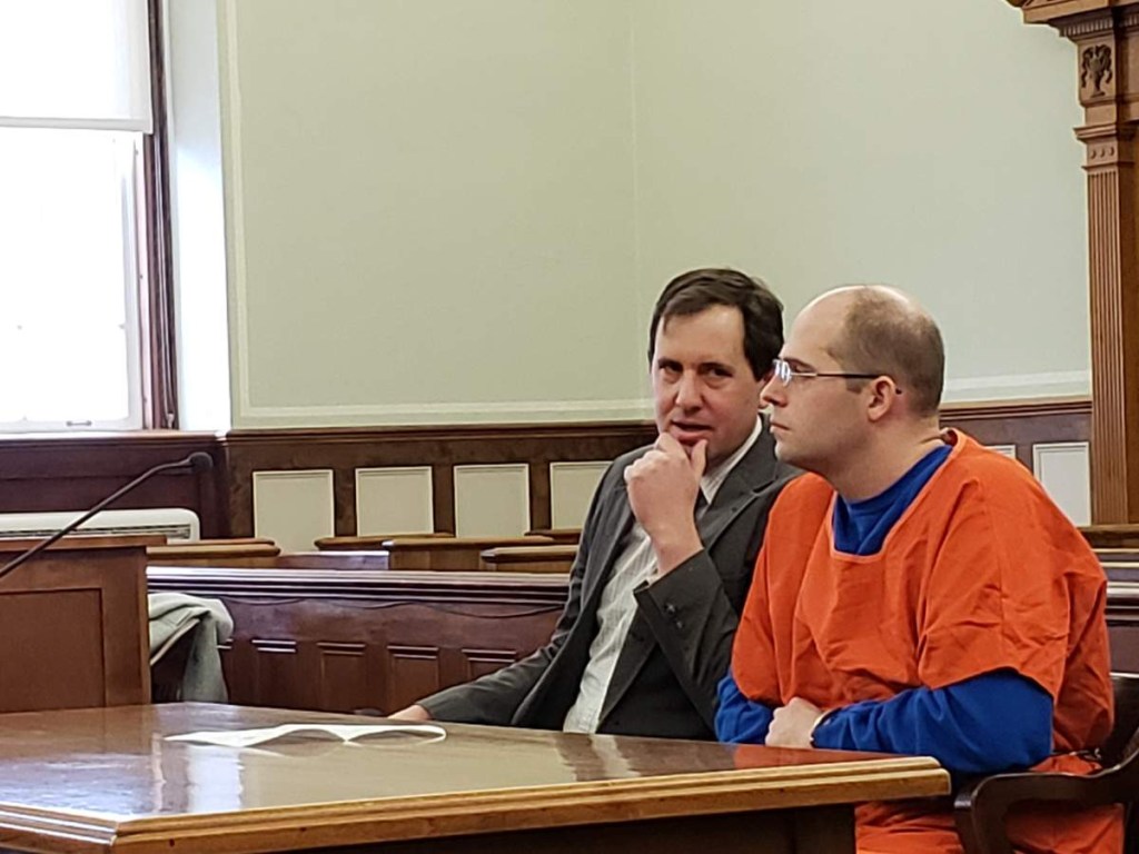 Zachary Titus, right, listens to his attorney, Jeremy Pratt, before the start of a hearing Monday in Knox County Superior Court.