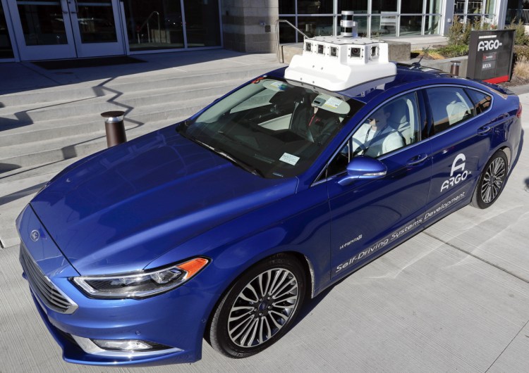 A test vehicle from Argo AI, Ford's autonomous vehicle unit, is parked at the company offices in Pittsburgh. Even the most optimistic experts say it will be 10 years before self-driving vehicles are everywhere, but others believe it will take decades.