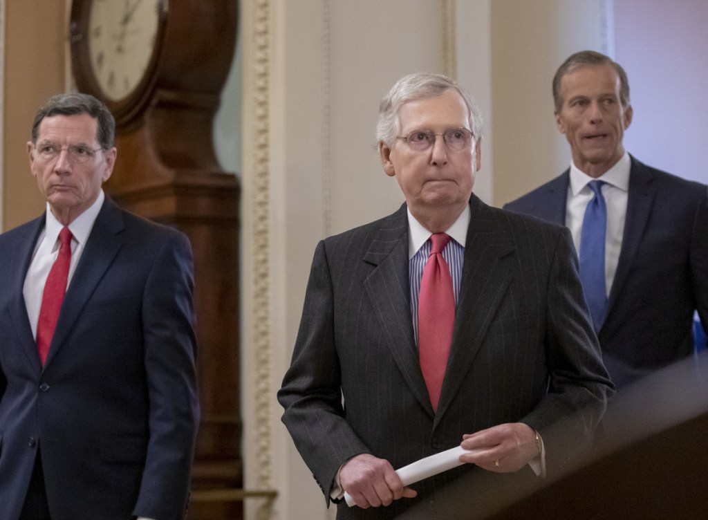 Associated Press/J. Scott Applewhite
Senate Majority Leader Mitch McConnell, R-Ky., flanked by Sens. John Barrasso, R-Wyo., left, and John Thune, R-S.D., meets with reporters Tuesday.