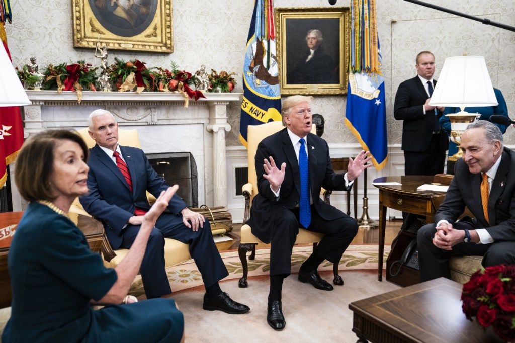 President Trump debates with House Minority Leader Nancy Pelosi, D-Calif., left, and Senate Minority Leader Chuck Schumer, D-N.Y., right, as Vice President Mike Pence listens during a meeting in the Oval Office in December. MUST CREDIT: Washington Post photo by Jabin Botsford.