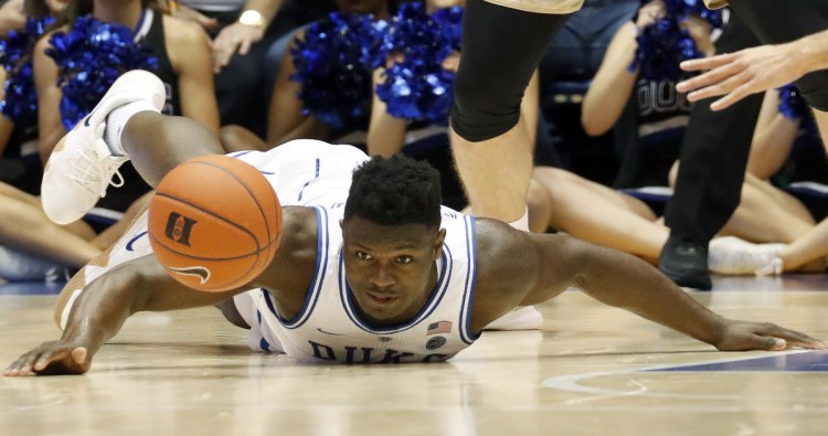 Zion Williamson of Duke keeps his eyes fixed on a loose ball during the first half Tuesday's game against Boston College in Durham, N.C. The Blue Devils improved to 20-2 with an 80-55 win.
