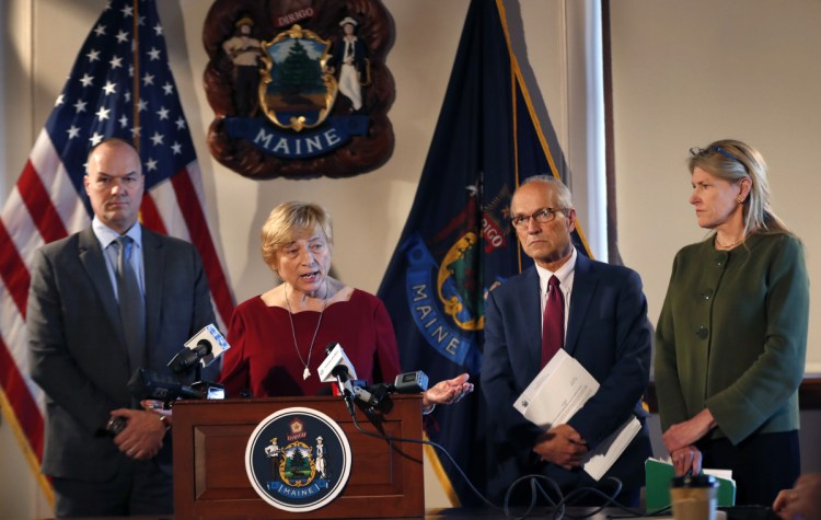 Gov. Janet Mills speaks at a news conference at the State House on Wednesday, accompanied by Corrections Commissioner Randy Liberty, left, Director of Opioid Response Gordon Smith, second from right, and Health and Human Services Commissioner Jeanne Lambrew. Mills later signed an executive order directing immediate action on Maine's opioid epidemic.