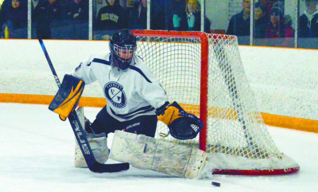 Yarmouth/Freeport's Allie Perrotta makes one of her 13 saves Wednesday night in a 5-2 win over Winslow/Gardiner/Cony in the girls' hockey North quarterfinals.