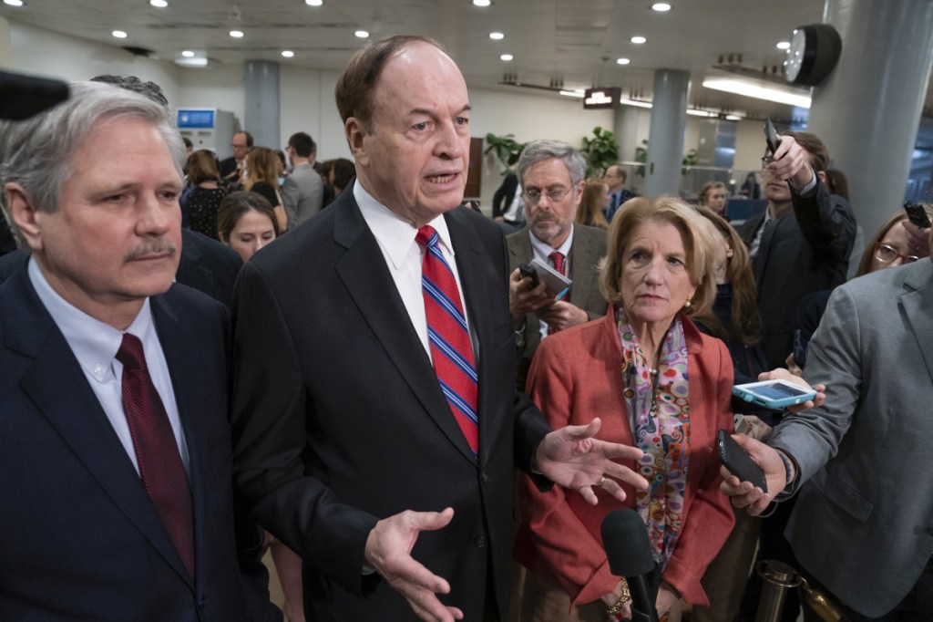 Sen. Richard Shelby, R-Ala., the top Republican on the bipartisan group of negotiators working to craft a border security compromise in hope of avoiding another government shutdown, is joined by Sen. John Hoeven, R-N.D., left, and Sen. Shelley Moore Capito, R-W.Va., right, as they speak with reporters after a briefing with officials about the U.S.-Mexico border, on Capitol Hill in Washington on Wednesday.