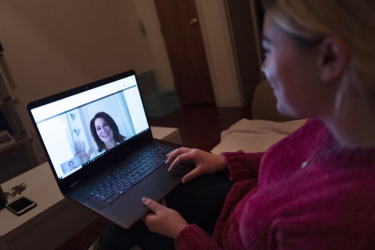 Caitlin Powers does a video chat with a doctor. Many employers offer such a virtual option, but just 8 percent of employees used telemedicine in 2017.