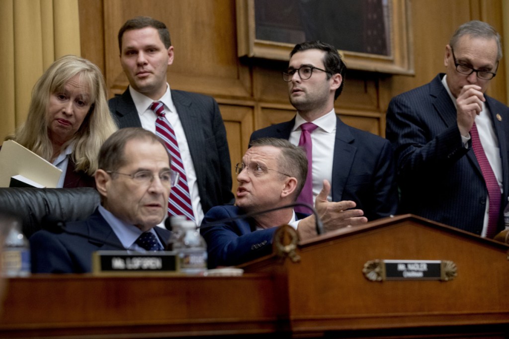 Rep. Doug Collins, R-Georgia, the top Republican on the House Judiciary Committee, center, objects to Judiciary Committee Chairman Jerrold Nadler, D-N.Y., left, summoning Acting Attorney General Matthew Whitaker before the Democratic-controlled panel on Capitol Hill on Friday in Washington.